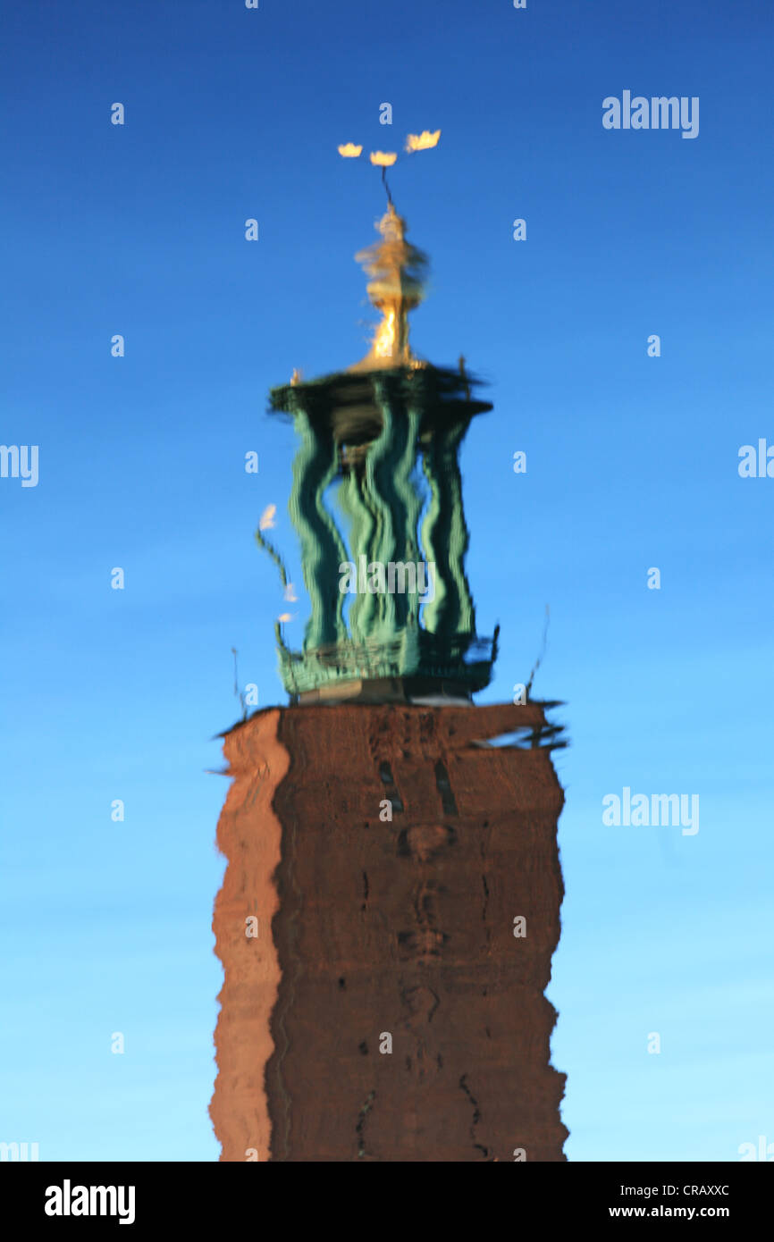 Water reflection of Stockholm City Hall's tower Stock Photo