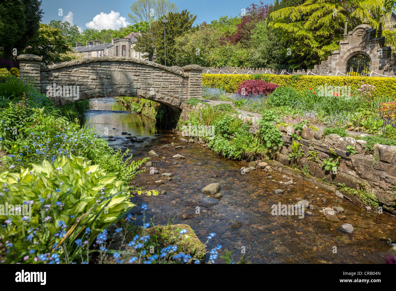 The Coronation gardens in the village of Waddington in Lancashire with the stream that runs through the centre of the village. Stock Photo