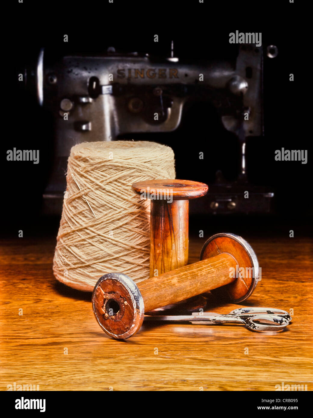 Antique Sewing Machine with thread Stock Photo