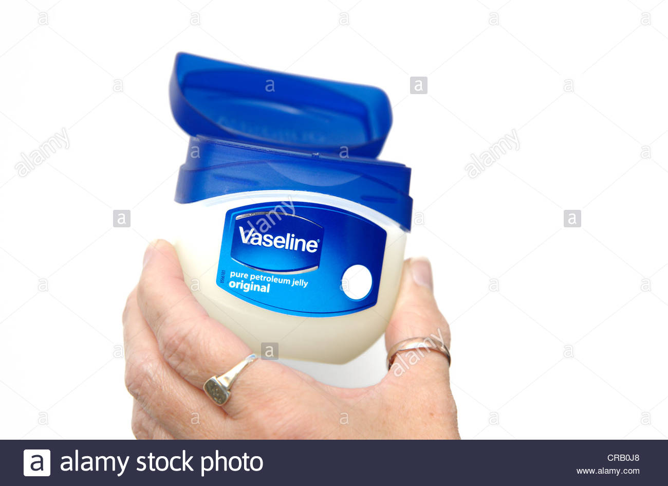 a tub of vaseline being hand held england uk - Stock Image
