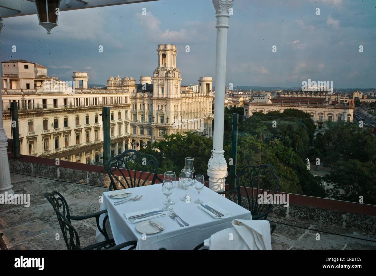Rooftop pool and restaurant at luxury Parque Central Hotel in Old Havana, with the Palacio Asturiano on the background Stock Photo