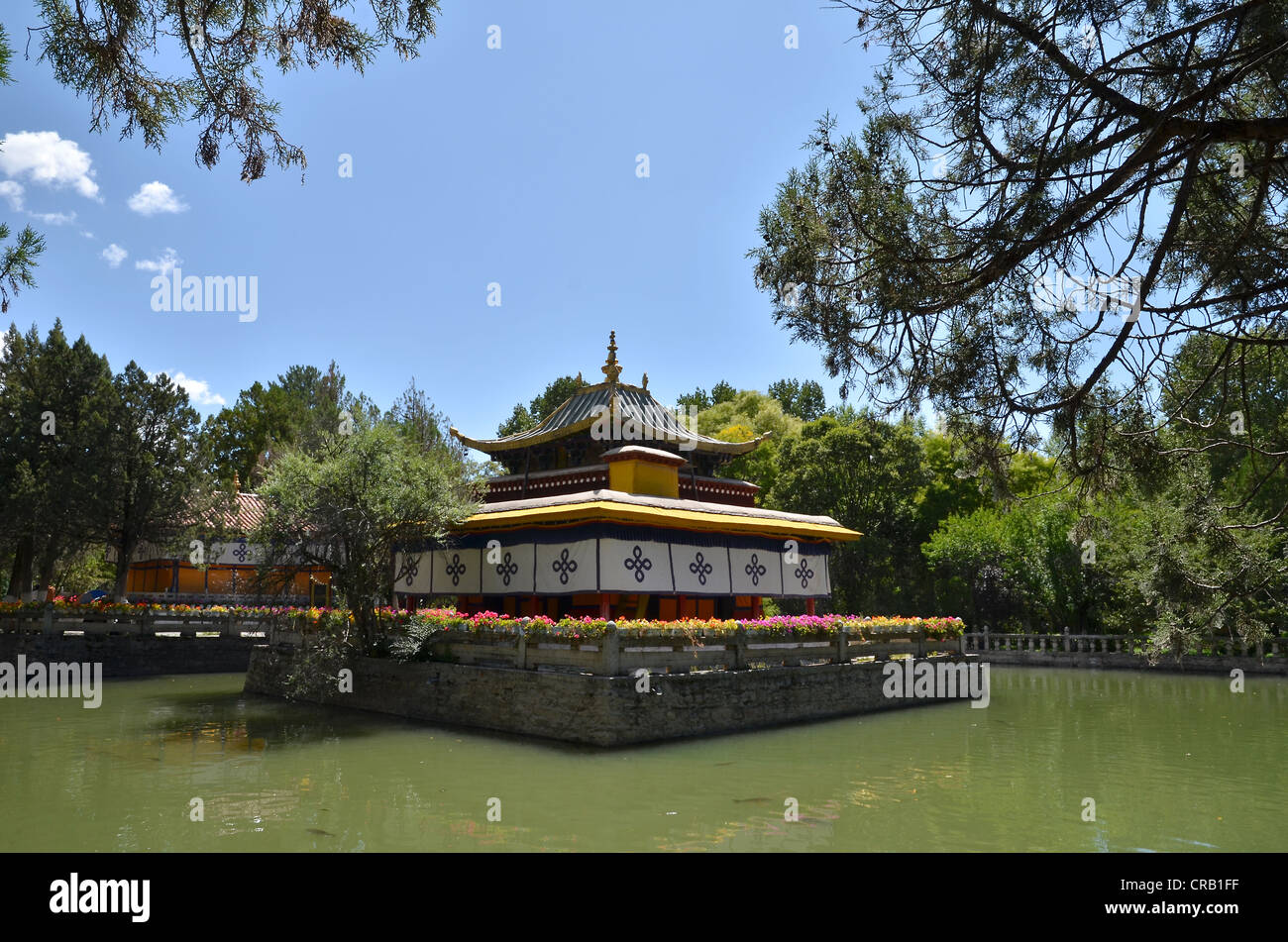 Small building in the centre of a man-made lake in the summer palace of the Dalai Lama in Norbulingka, jewel garden, Lhasa Stock Photo
