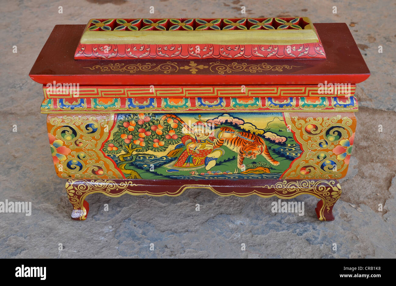 Tibetan handicrafts, precious little painted wooden box, lacquer piece, with motifs from Tibetan history, mythology, for burning Stock Photo