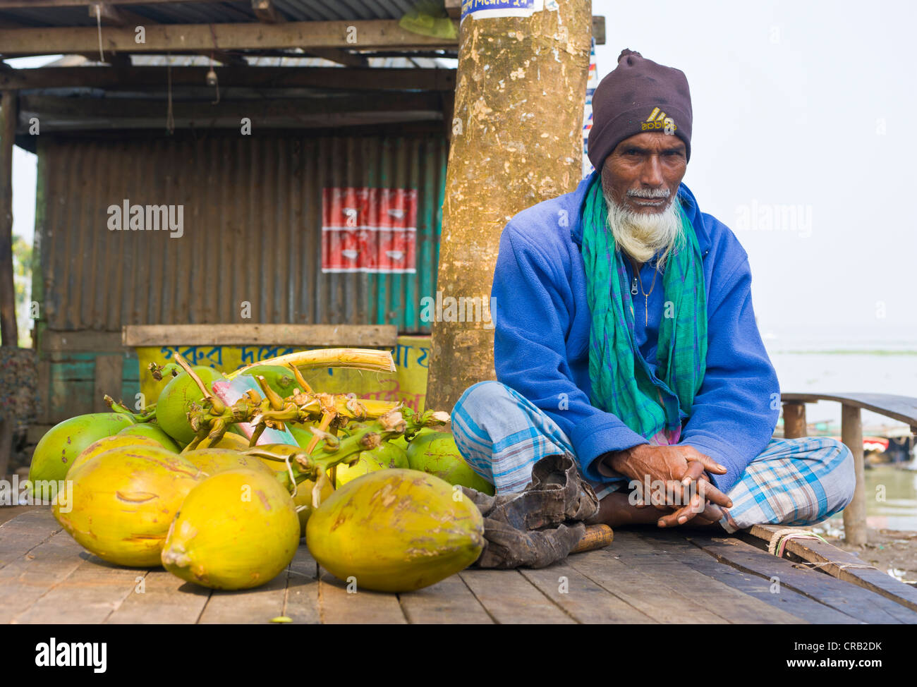 Old man sitting on the floor, Bangladesh, Asia Stock Photo