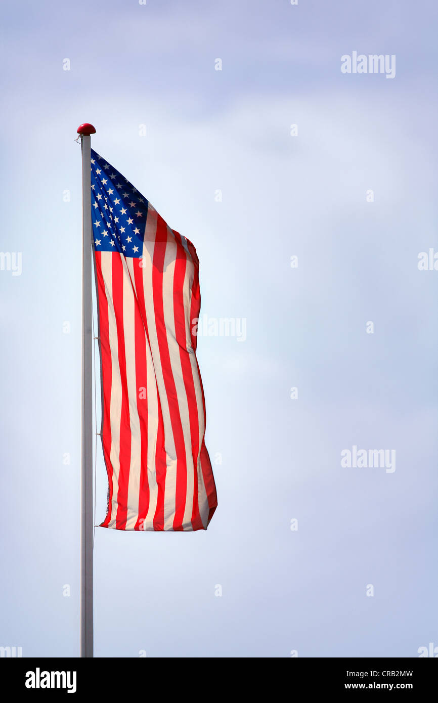 Flag, national flag of the United States, flying on a flag pole Stock Photo