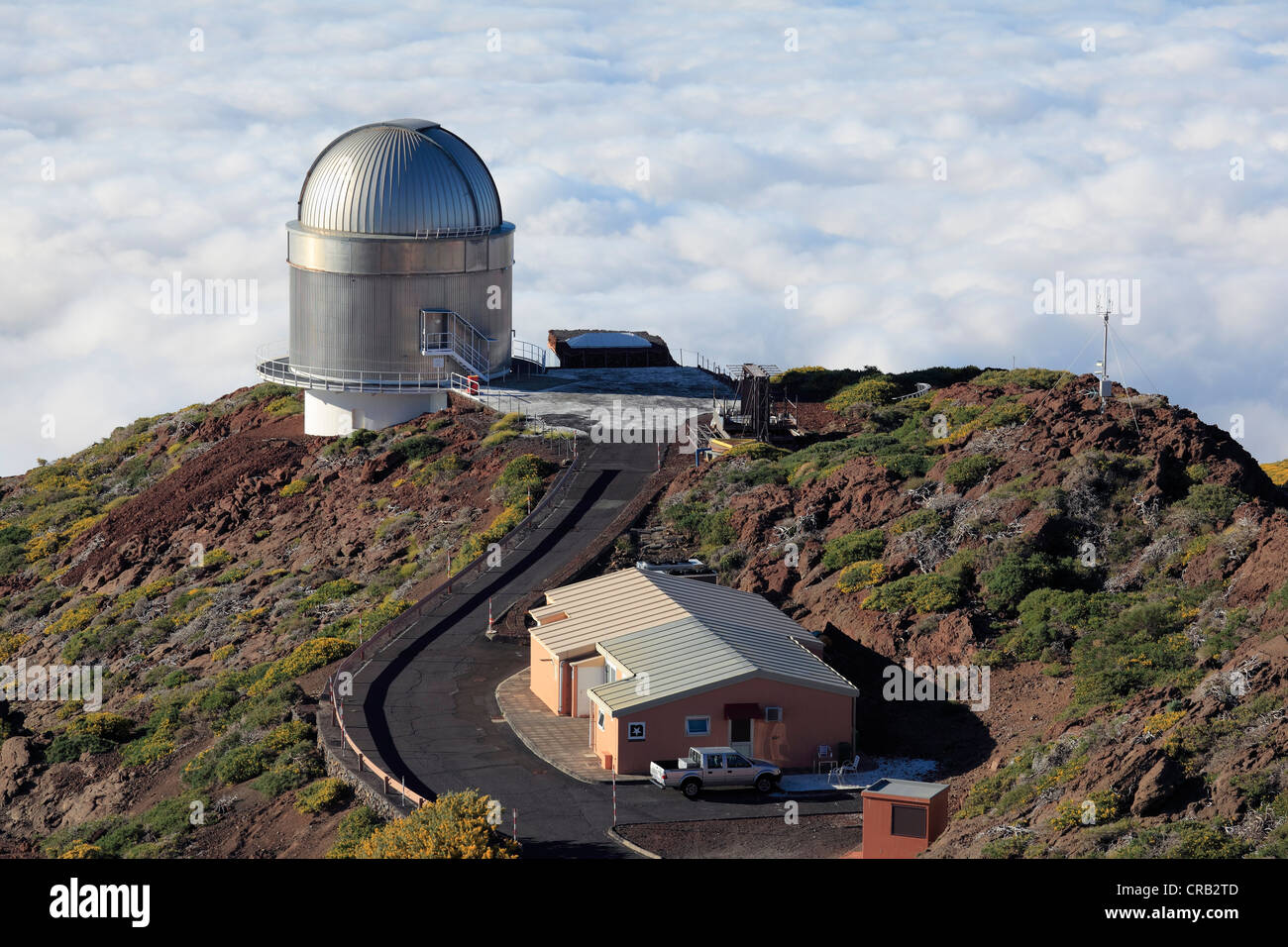 View over the cloud cover with Nordic Optical Telescope observatory, astronomical telescope, Roque de los Muchachos Observatory Stock Photo