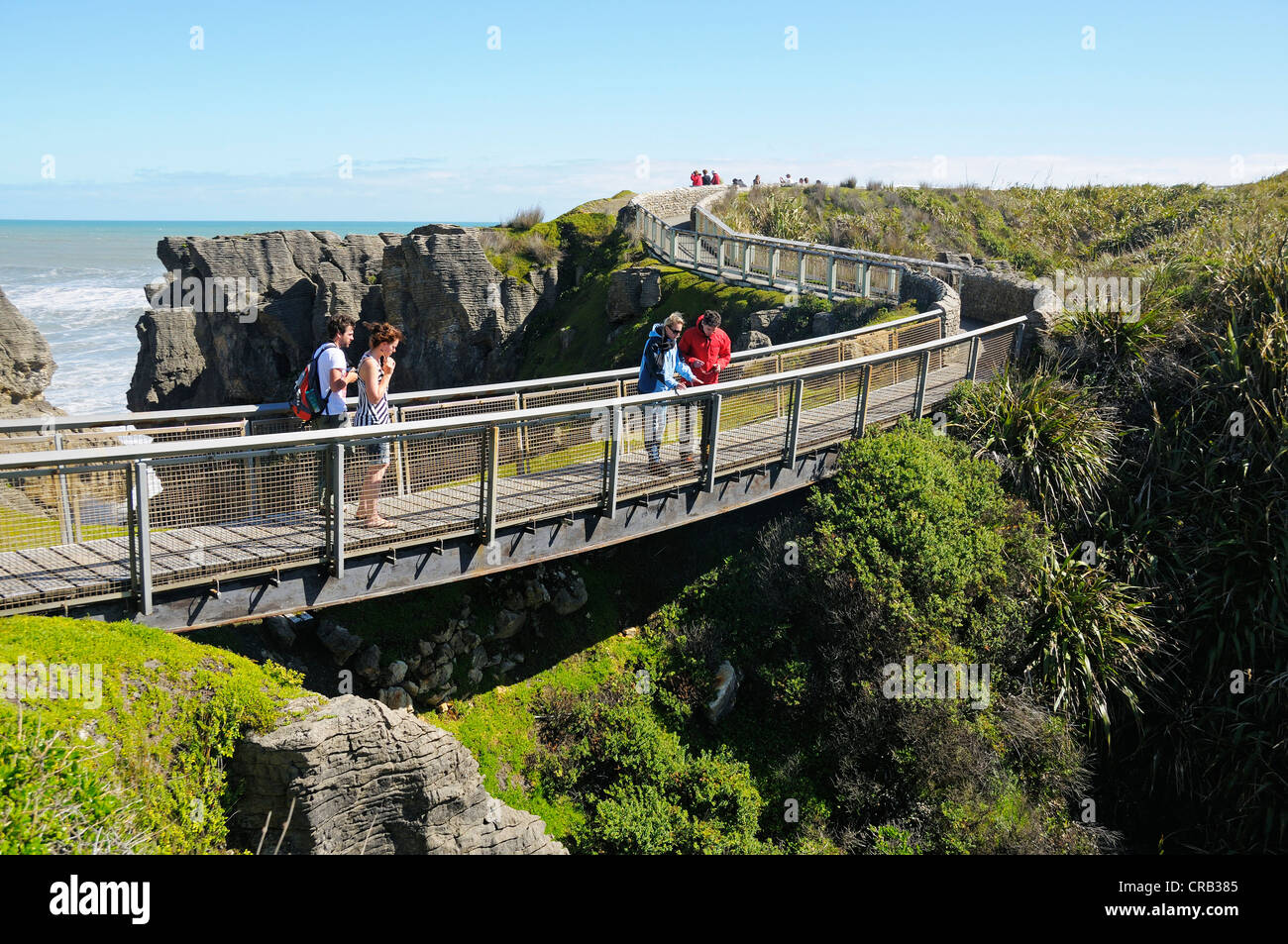 Tourists visiting the rock formations of Pancake Rocks Punakaiki, Paparoa National Park, South Island, New Zealand Stock Photo
