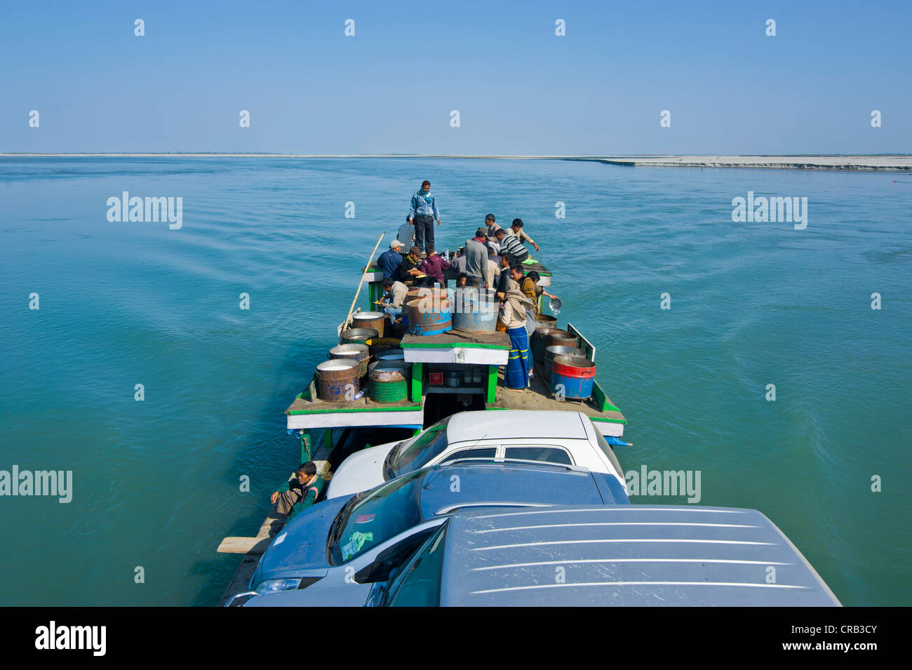 Ferry loaded with people and cars, on the Brahmaputra River, Assam, North East India, India, Asia Stock Photo