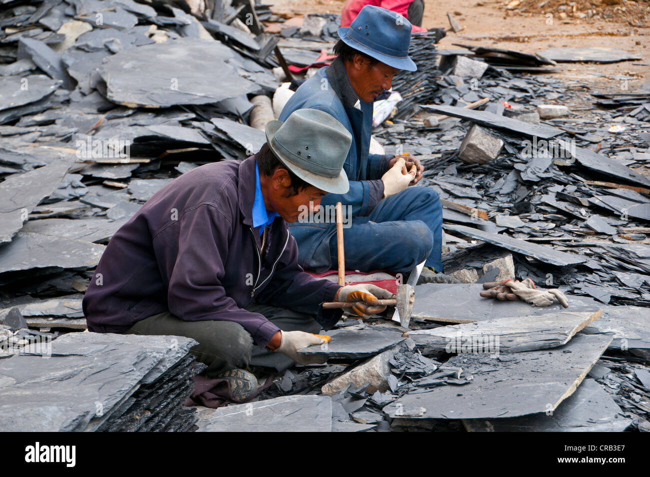 Workers breaking stones, Drepung Temple, Lhasa, Tibet, Asia Stock Photo