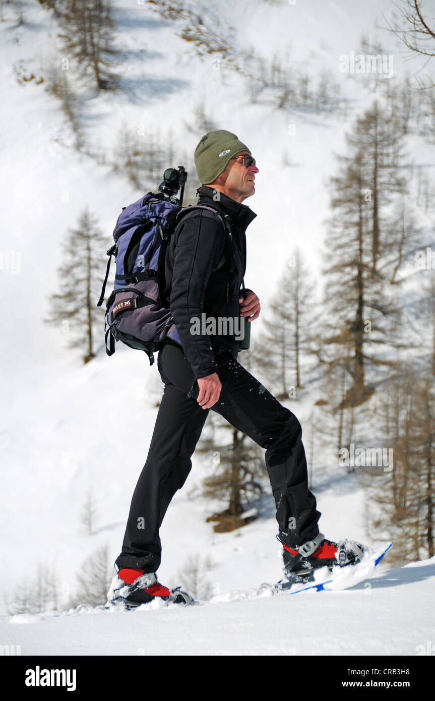 National Park Ranger hiking with snowshoes in Grosse Fleisstal valley near Heiligenblut, National Park Hohe Tauern, Carinthia Stock Photo