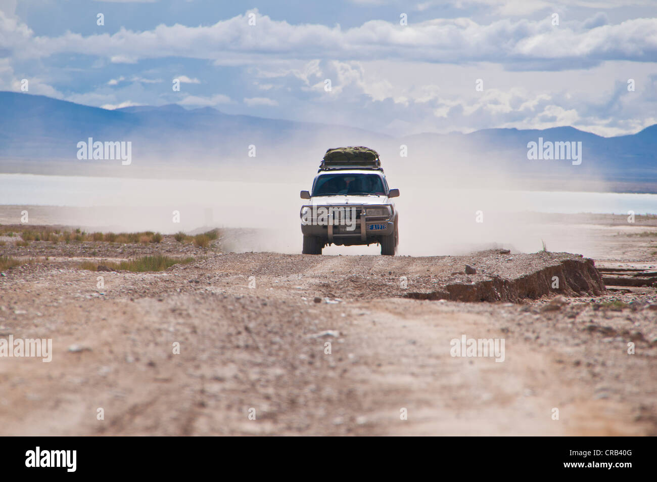 Land Cruiser in a cloud of dust on the road from Gerze to Tsochen, Western Tibet, Tibet, Asia Stock Photo