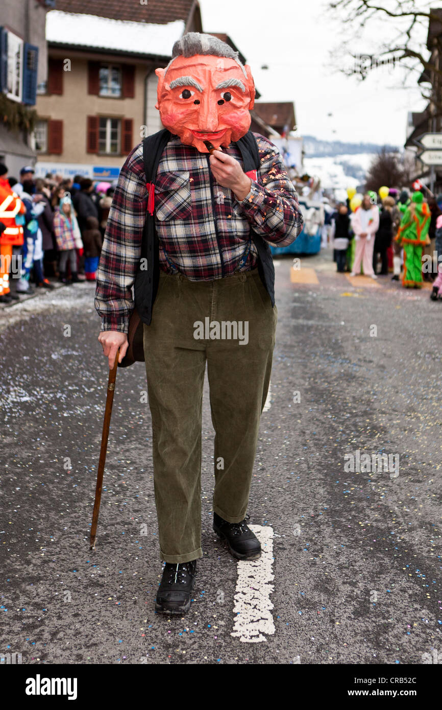 Old man walking on a stick, costume, 35th Motteri parade in Malters, Lucerne, Switzerland, Europe Stock Photo