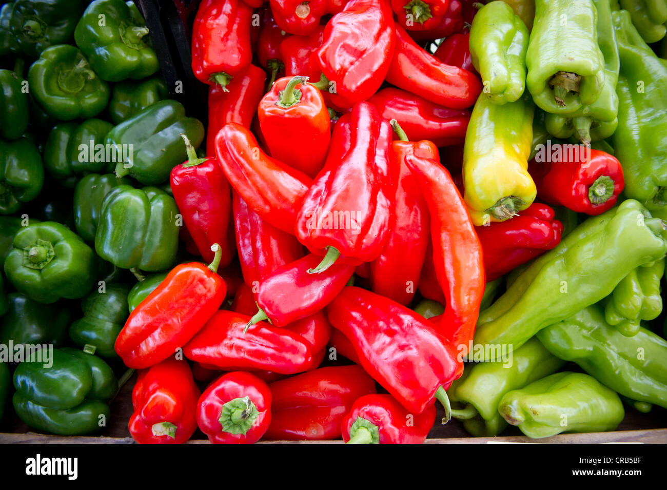 red and green peppers at a farmers market Stock Photo