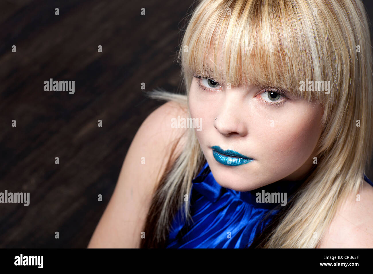 Young blond woman wearing blue lipstick, portrait Stock Photo