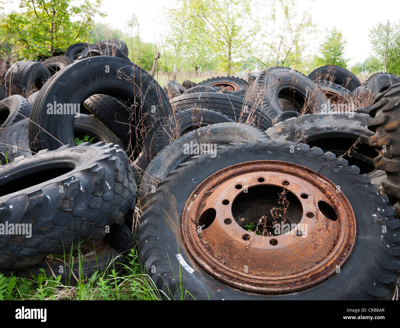 Old tyres littering the landscape Stock Photo