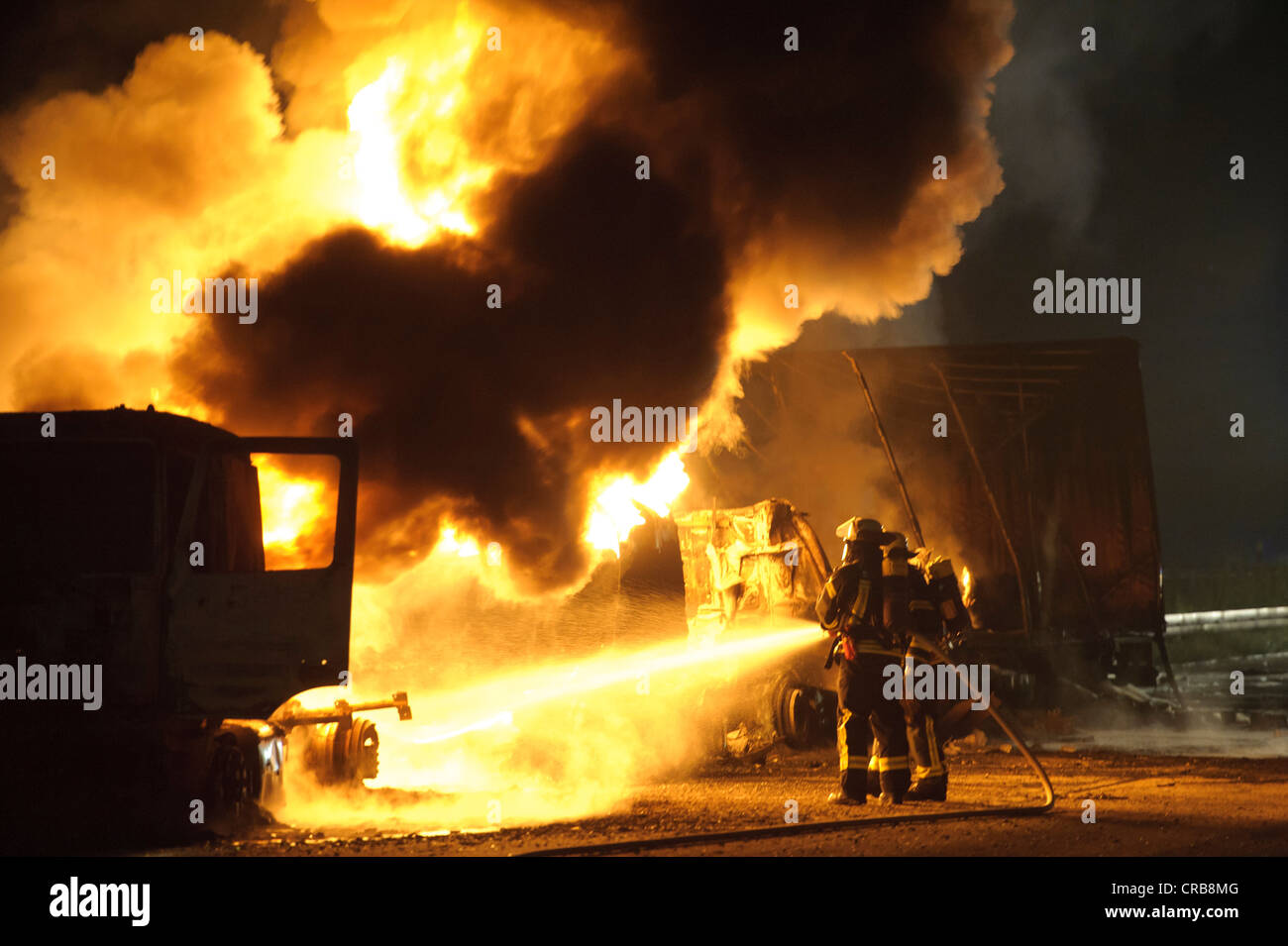 Two burning trucks, including a tanker with heating oil, fatal accident on the A8 motorway, Stuttgart, Baden-Wuerttemberg Stock Photo