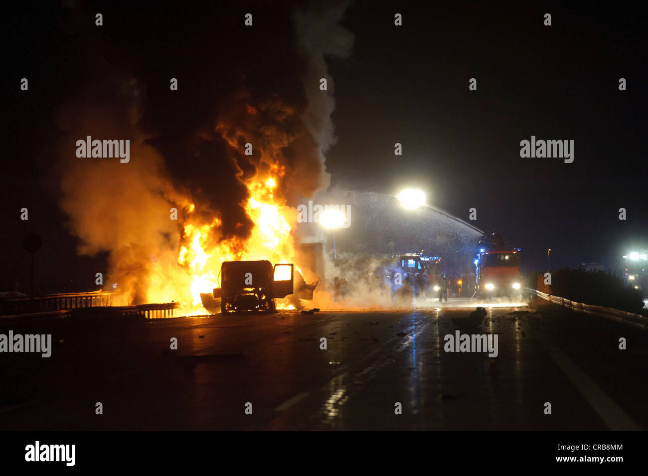 Two burning trucks, including a tanker with heating oil, fatal accident on the A8 motorway, Stuttgart, Baden-Wuerttemberg Stock Photo