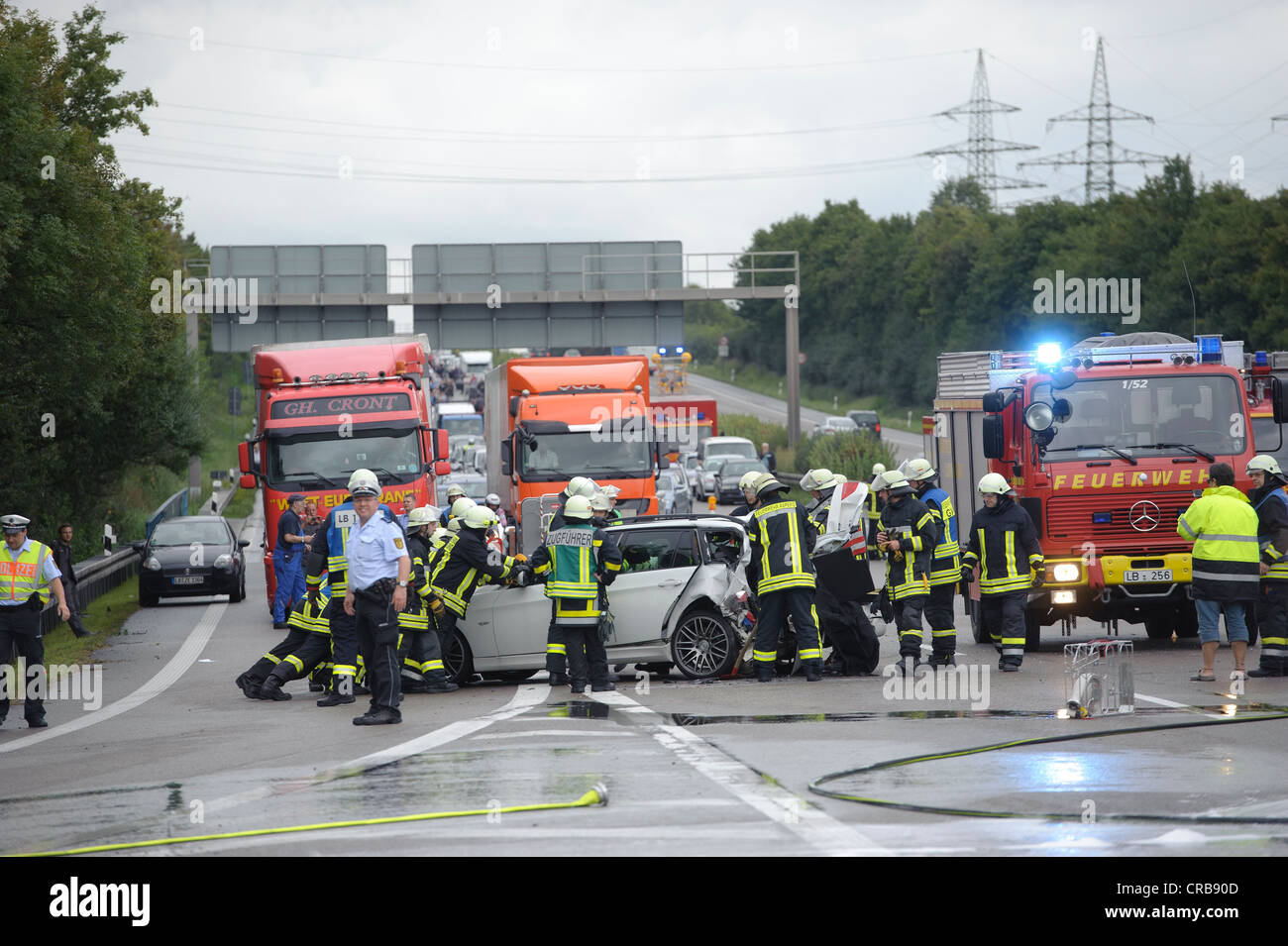 Firefighters in a rescue operations following a serious road traffic accident on the Autobahn A81 motorway, Ludwigsburg Stock Photo