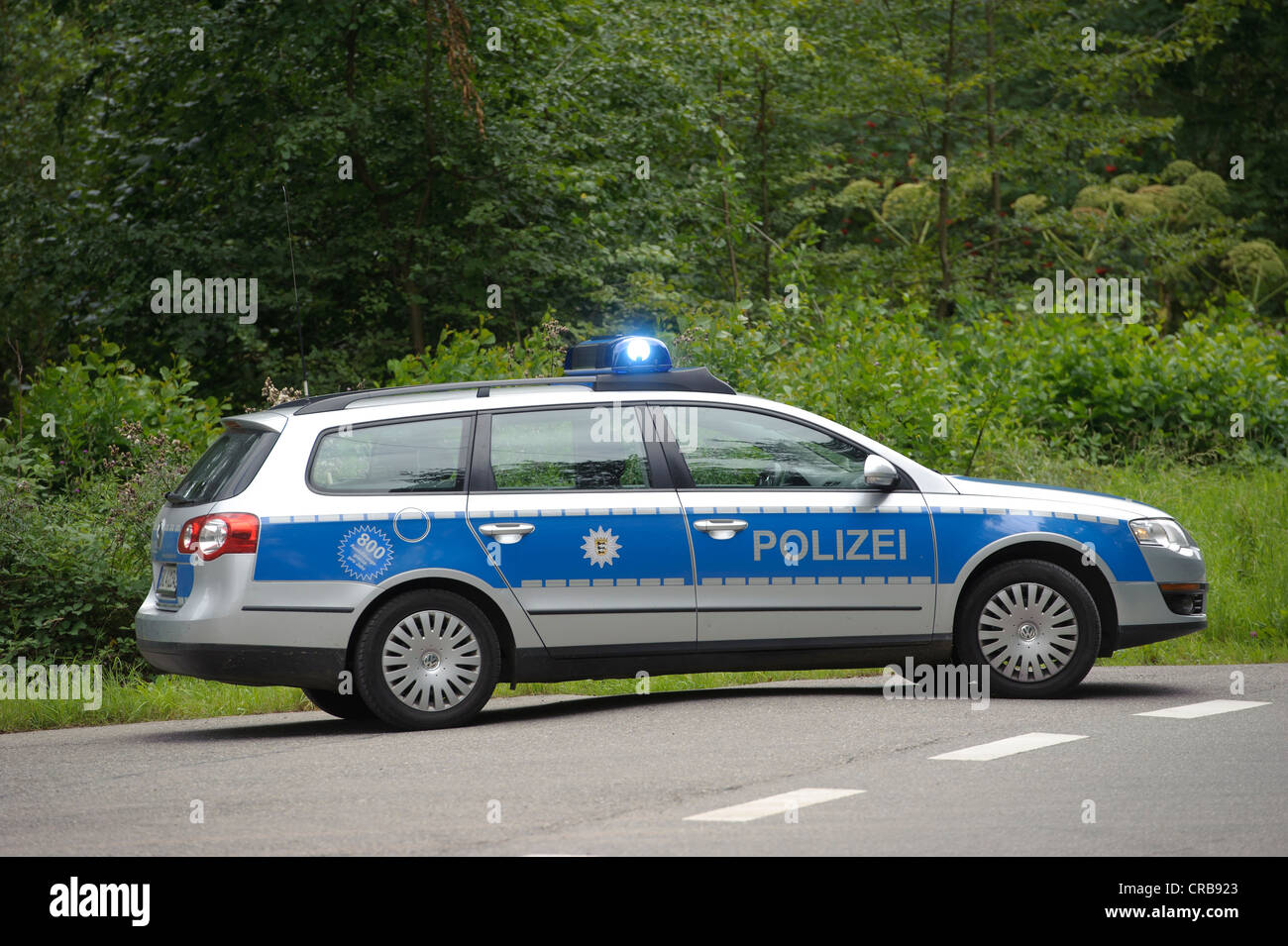 Blue police car with flashing blue light, Sindelfingen, Baden-Wuerttemberg, Germany, Europe Stock Photo