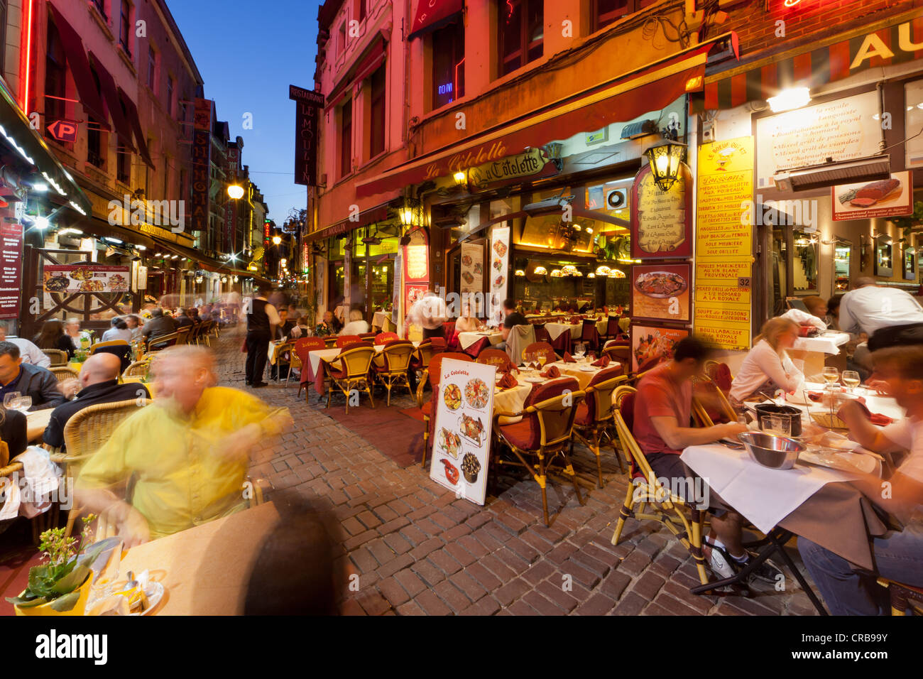 Guests sitting in street restaurants in the old town, Beenhouwersstraat