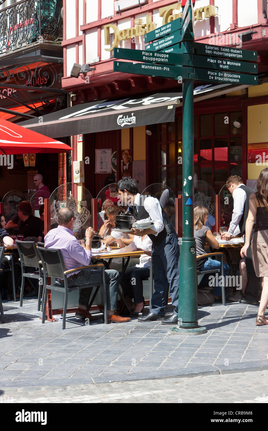 Tourists in a restaurant in the Rue de la Bourse, Brussels, Belgium, Benelux, Europe Stock Photo