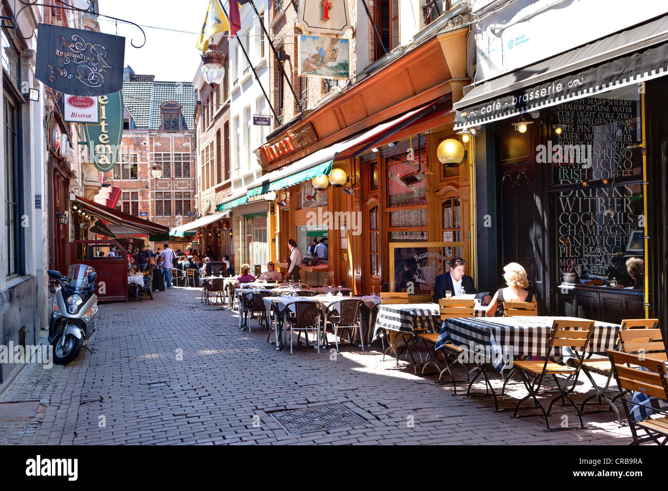 Tourists at a sidewalk cafe in the Rue des Dominicans, Brussels, Belgium, Benelux, Europe Stock Photo
