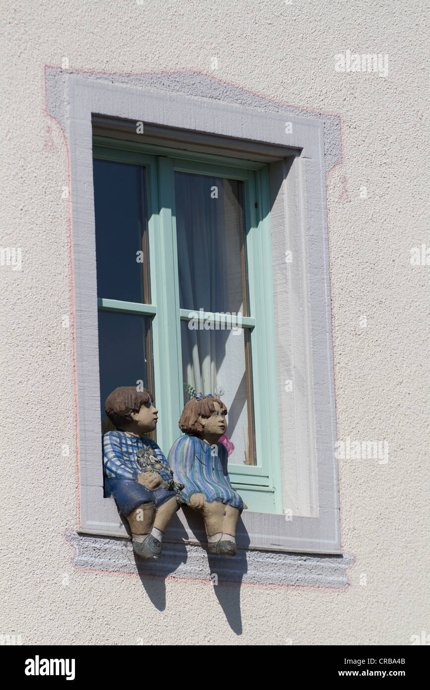Figures seated on a window sill, Hoer Peninsula, Konstanz district ...