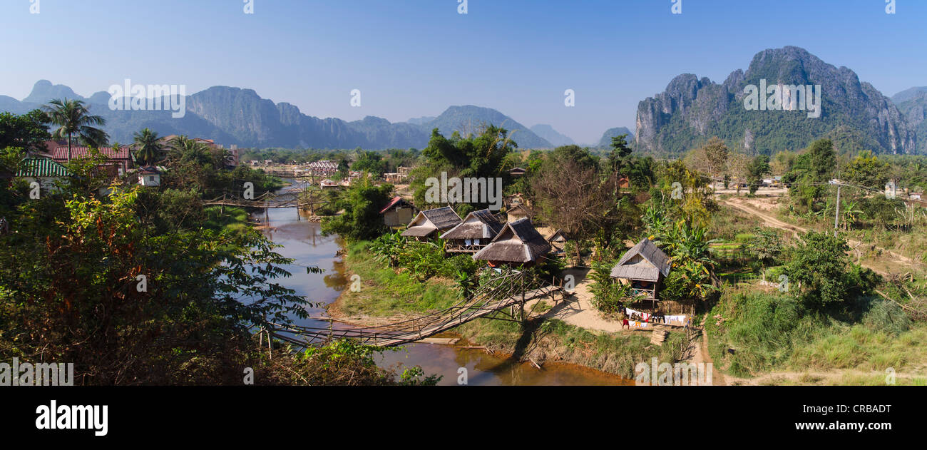 Village, karst mountains, Nam Song river, Vang Vieng, Vientiane, Laos, Indochina, Asia Stock Photo