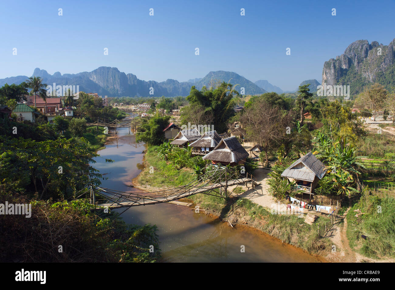 Village, karst mountains, Nam Song river, Vang Vieng, Vientiane, Laos, Indochina, Asia Stock Photo
