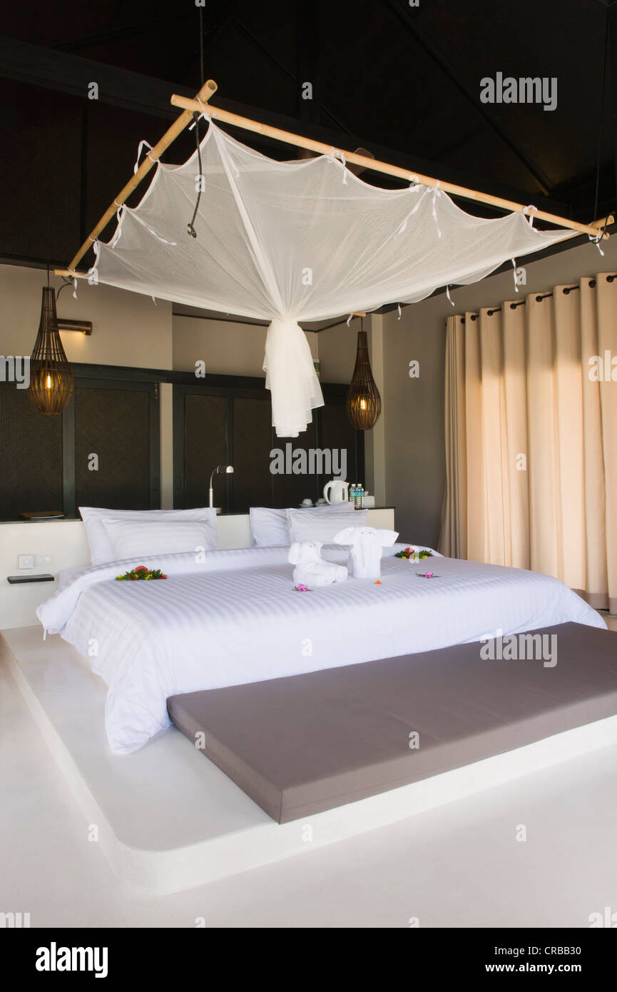 Bed with a mosquito net in a luxury bungalow, The Sevenseas Resort