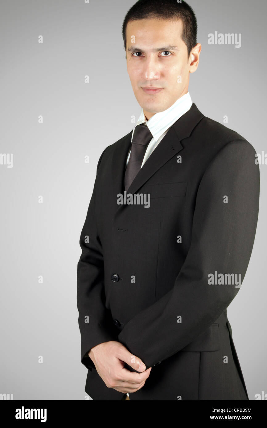 Business man wearing black suit Stock Photo - Alamy