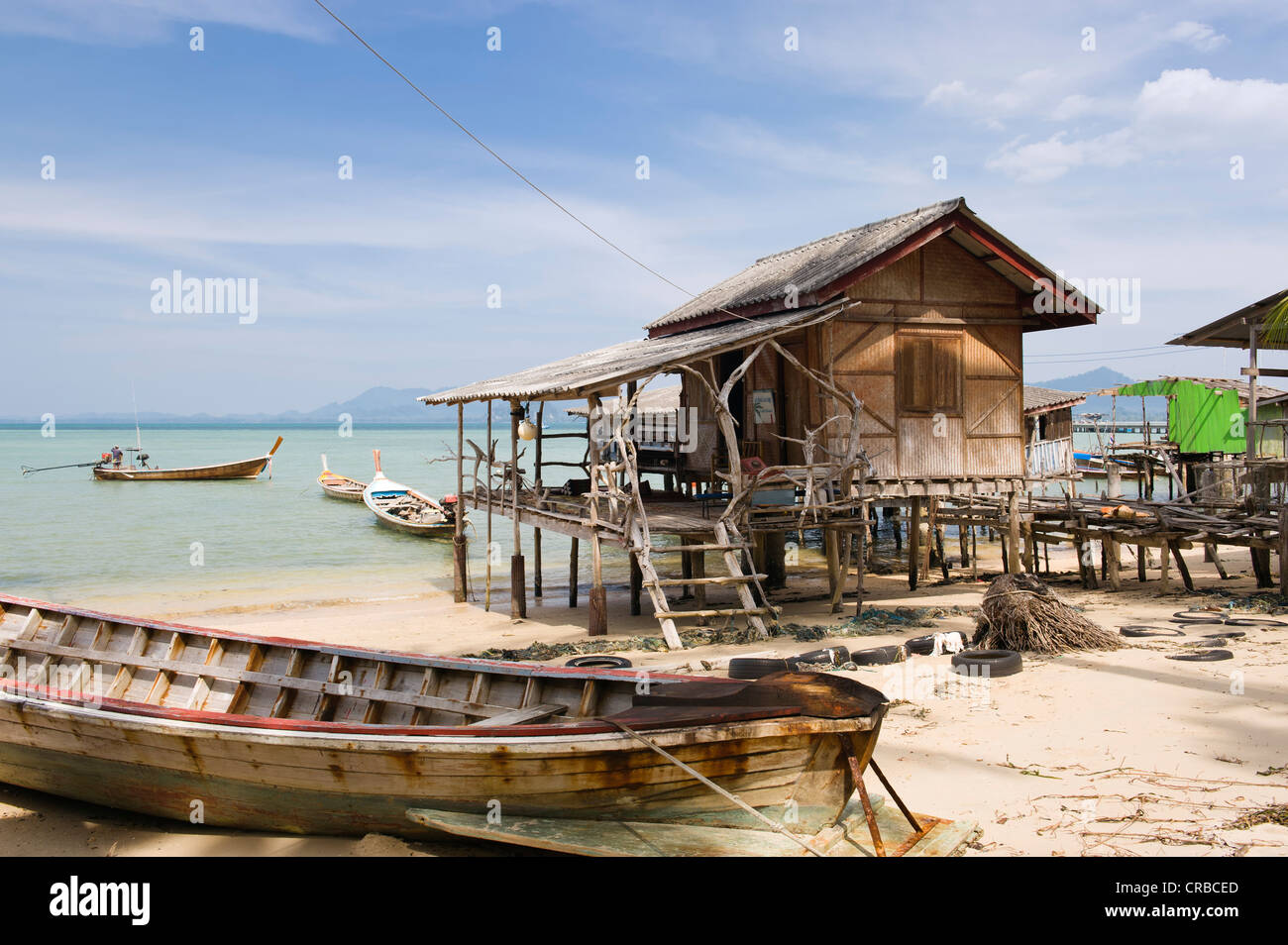 fishermans-house-on-stilts-long-tail-boat-fishing-village-ko-muk-or-CRBCED.jpg