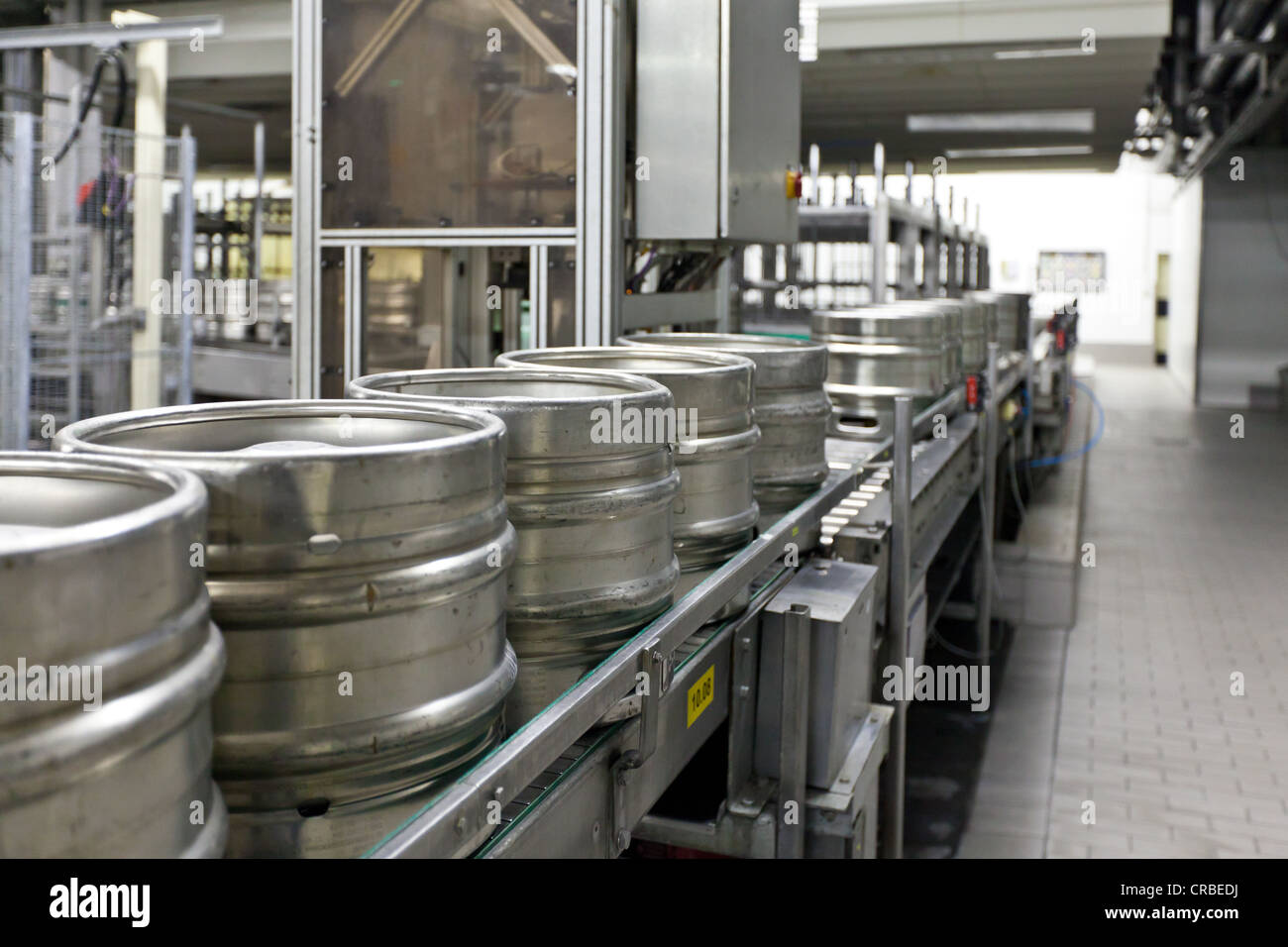 Beer kegs on a conveyor belt, waiting to be filled, Binding brewery
