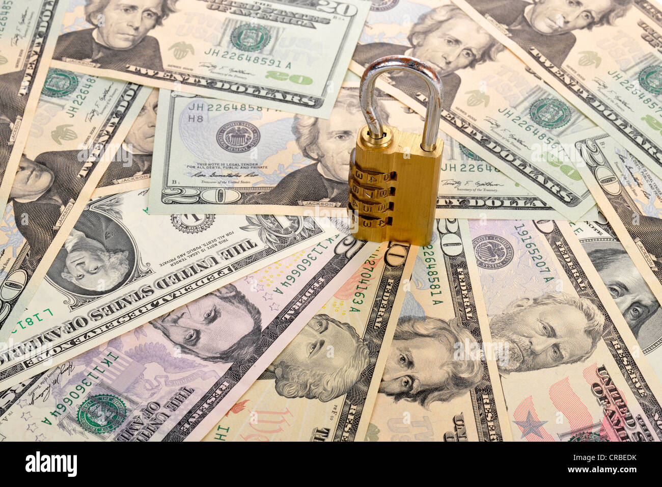 Combination lock on U.S. dollar banknotes, symbolic image of monetary security Stock Photo