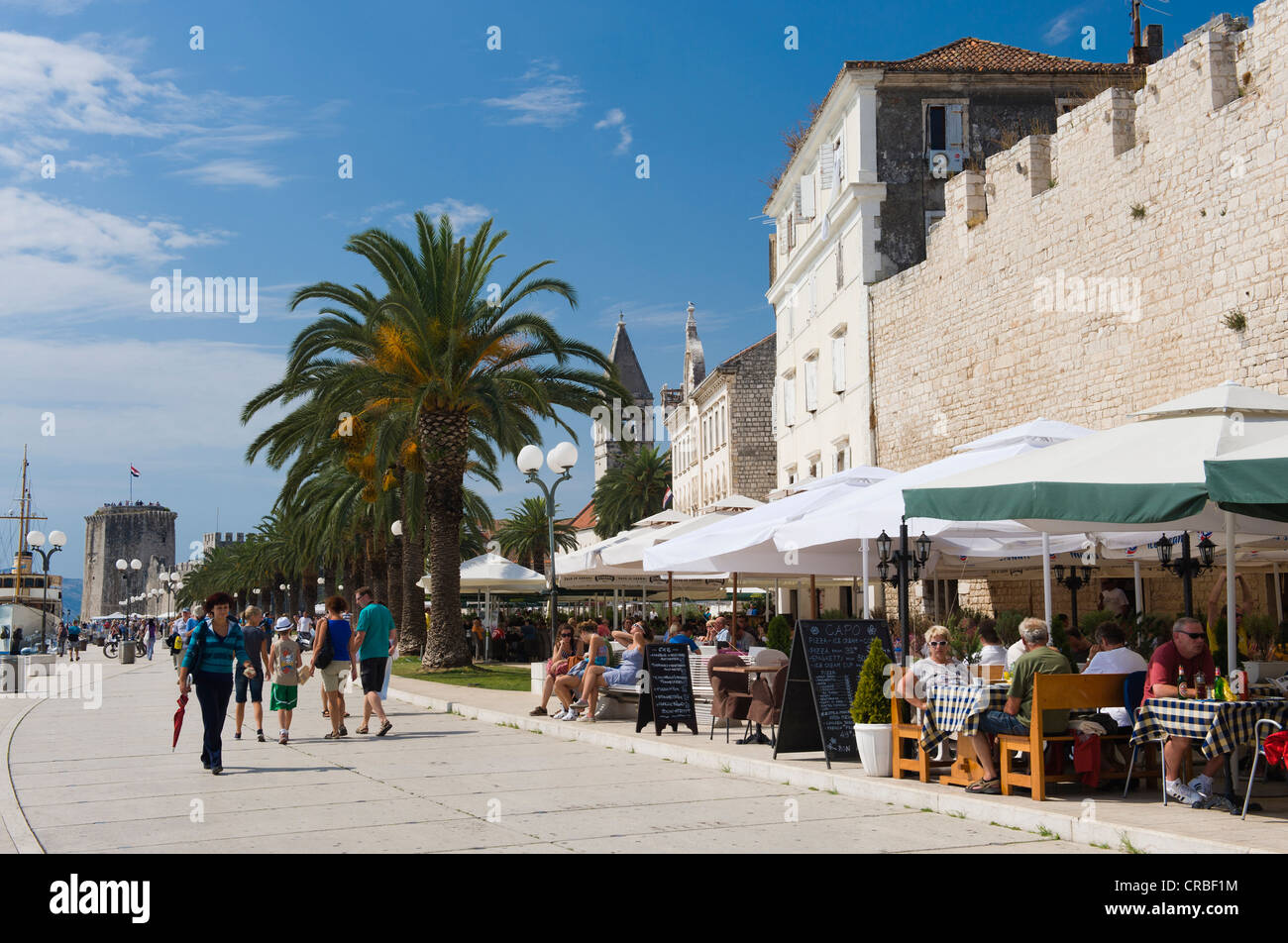 Riva promenade, restaurant and city wall, old town, UNESCO World Heritage Site, Trogir, Dalmatia, Croatia, Europe Stock Photo