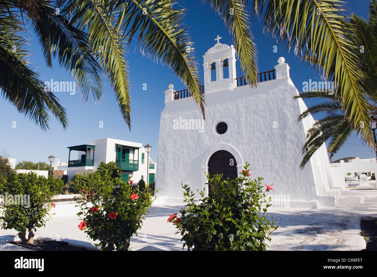 Church and palm trees, Uga, Lanzarote, Canary Islands, Spain, Europe Stock Photo