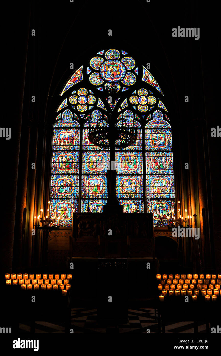 Historic stained glass window in the sanctuary, Chapelle Notre-Dame des Sept Douleurs chapel, Cathedral of Notre-Dame de Paris Stock Photo