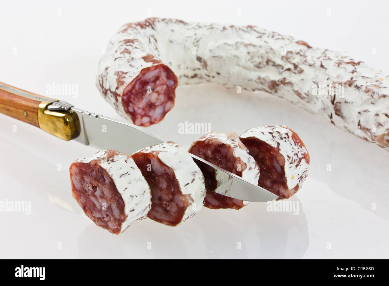 Gourmet salami, premium salami cut with knife Stock Photo Alamy