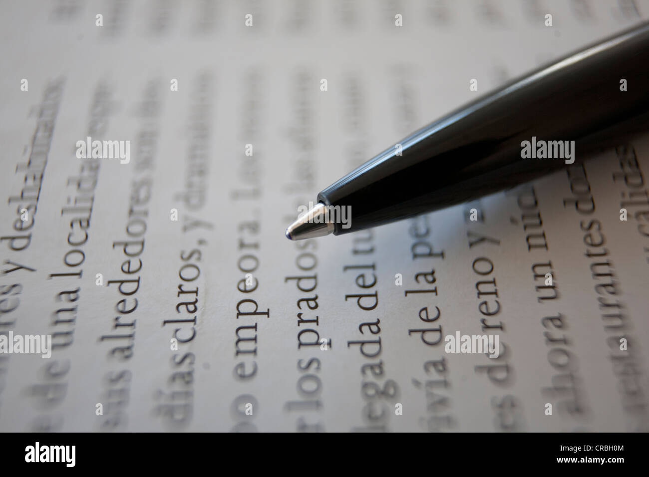Spanish book page with pencil Stock Photo Alamy
