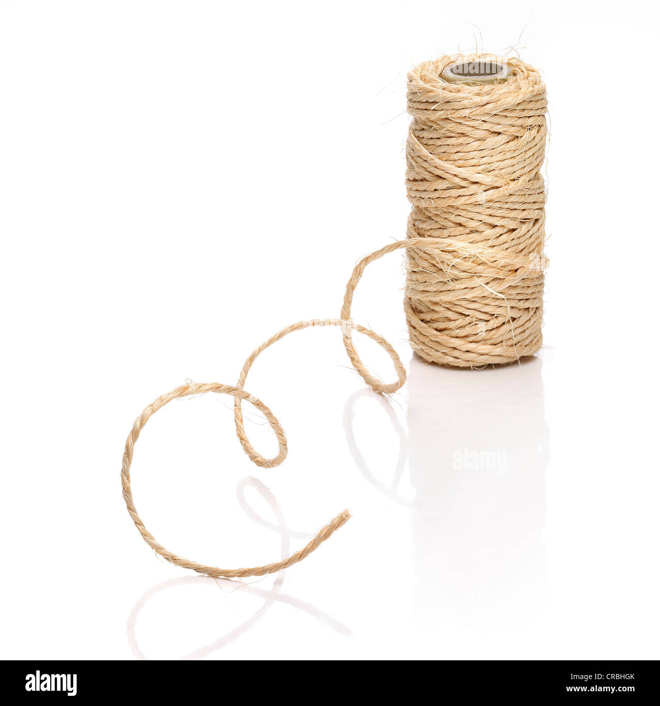 Curved thick string and an roll on white background Stock Photo