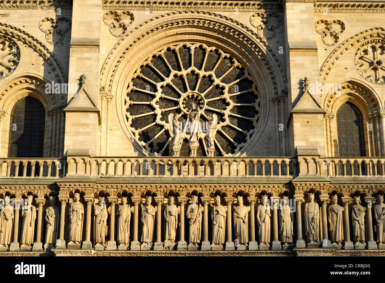 Gothic ornamental figures over the main portal, rose window, west facade, Cathedral of Notre-Dame de Paris, Ile de la Cité Stock Photo