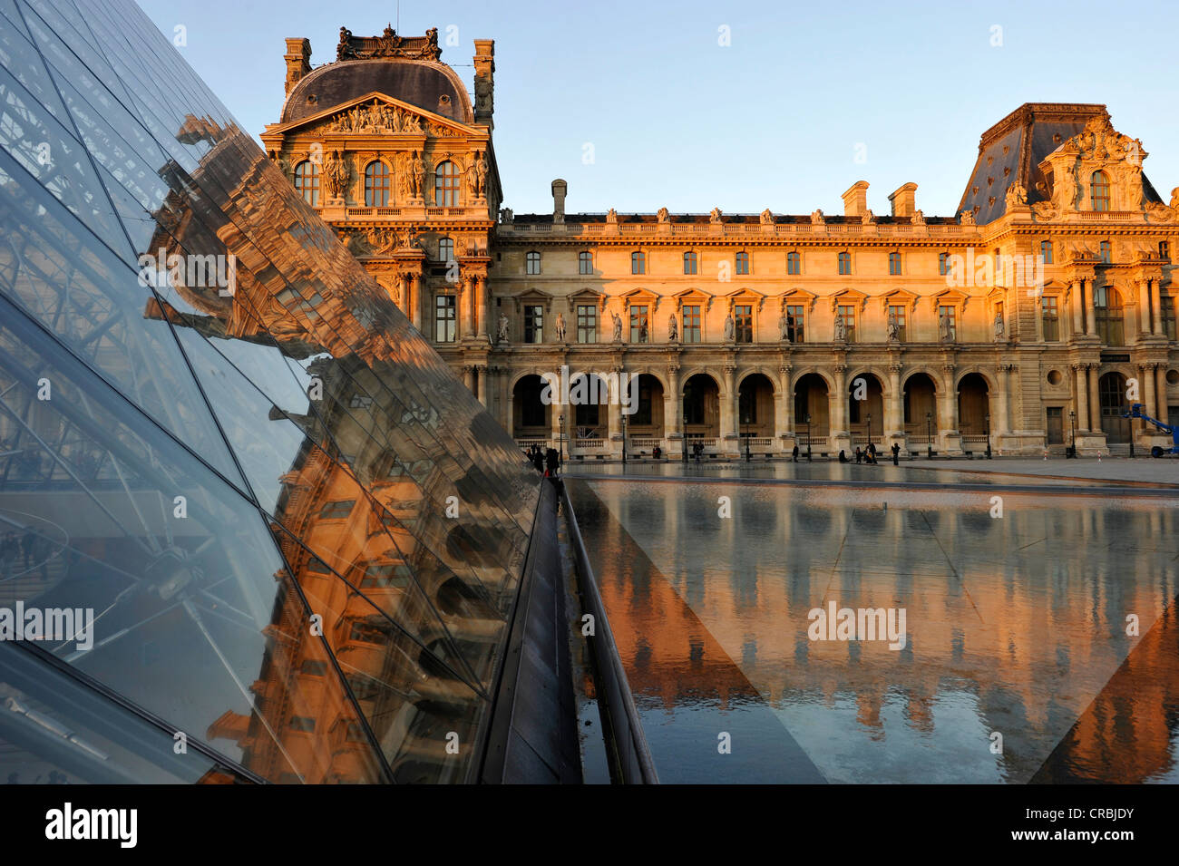 Pavilion Richelieu, left, Pavillon Colbert, right, glass pyramid entrance in front, Palais du Louvre or Louvre Palace museum in Stock Photo