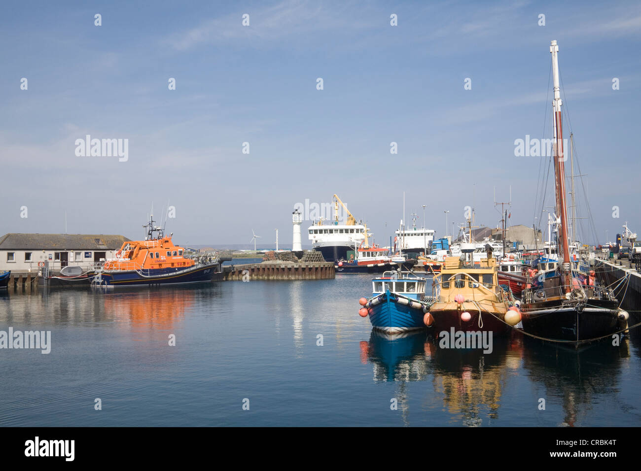 Kirkwall Orkney Islands Mainland Scotland UK May Fishing boats and lifeboat in this capital town's harbour Stock Photo