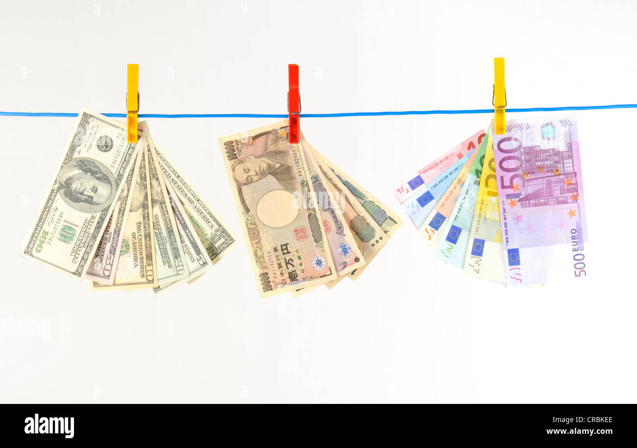 Euro, U.S. dollars and Japanese yen, notes on a clothesline, symbolic image for money laundering, dirty money, exchange rate Stock Photo