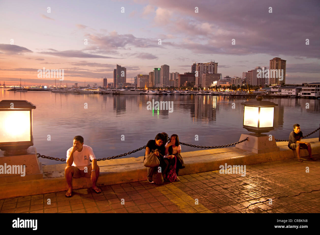 Evening in Harbour Square in front of the skyline along Manila Bay, Manila, Philippines, Asia Stock Photo