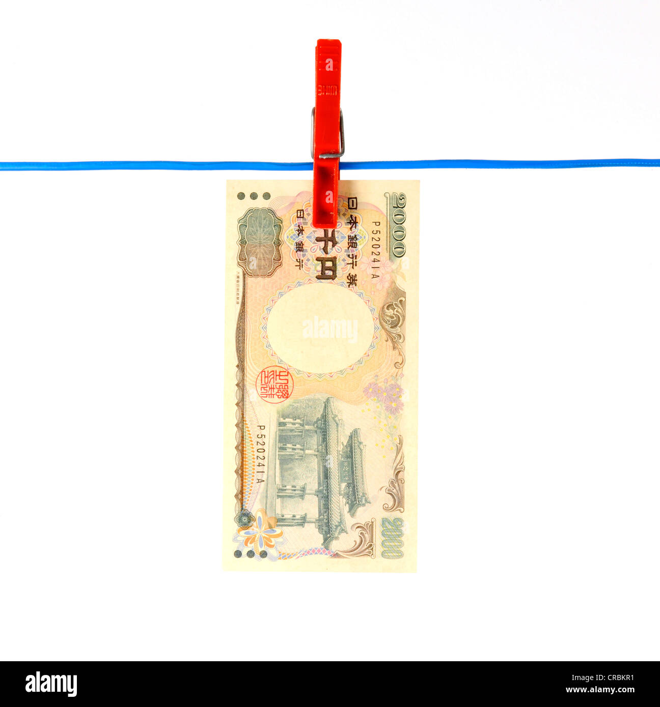 Japanese Yen bank note on a clothesline, symbolic image for money