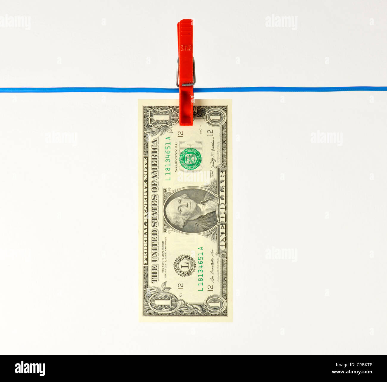 U.S. dollar bank note on a clothesline, symbolic image for money laundering, dirty money Stock Photo