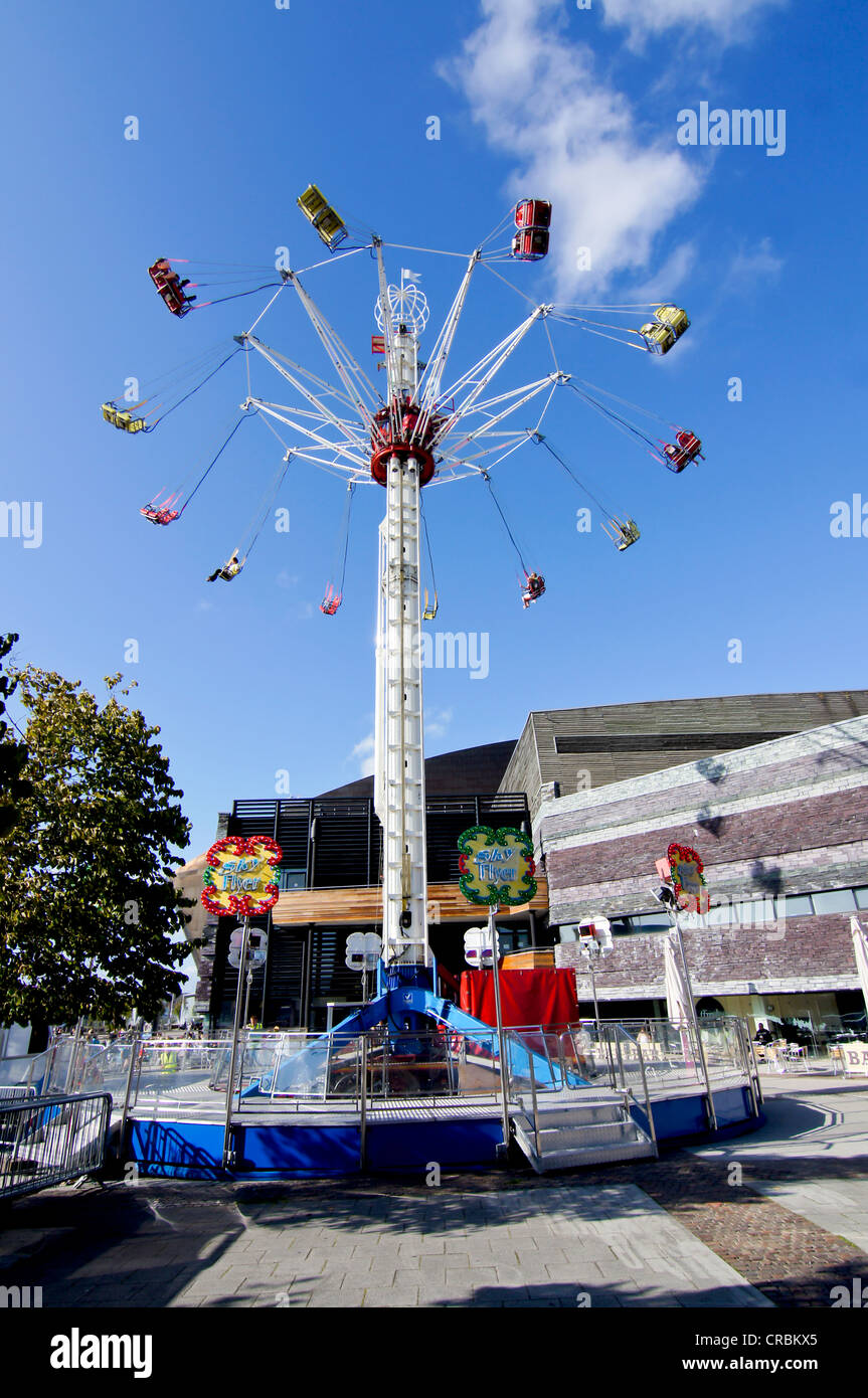 UK, Wales, Cardiff, Millenium Center swing carousel Stock Photo Alamy