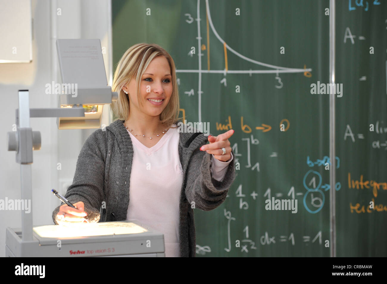 Trainee teacher, prospective teacher, young teacher, mathematics, blackboard, classroom, overhead projector, Baden-Wuerttemberg Stock Photo