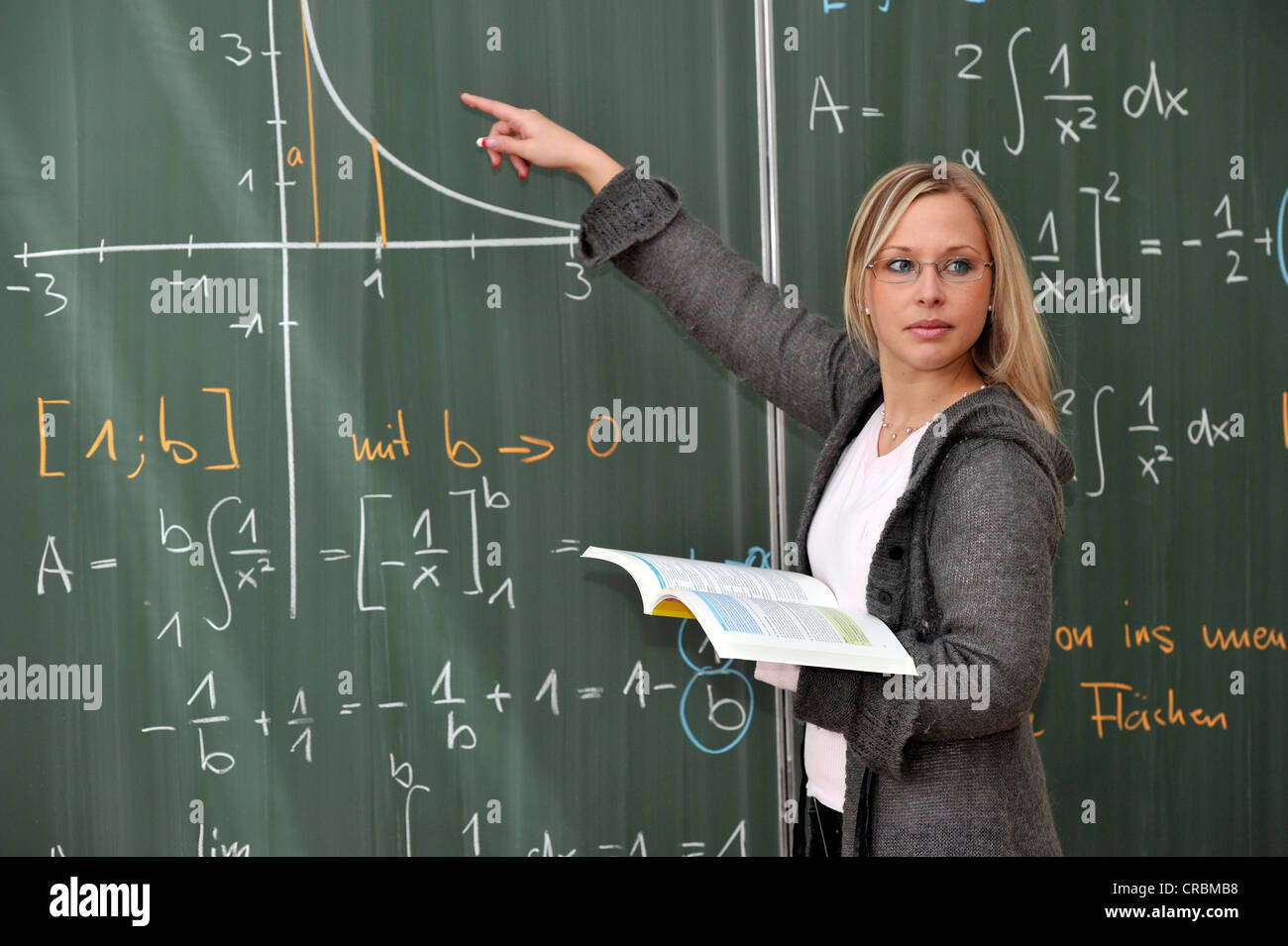 Trainee teacher, prospective teacher, young teacher, mathematics, blackboard, classroom, Baden-Wuerttemberg, Germany, Europe Stock Photo